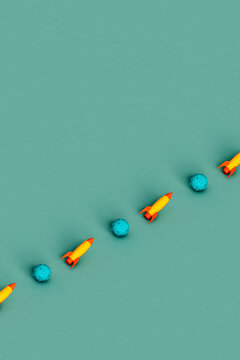 a row of Space shuttles and space rock on green background