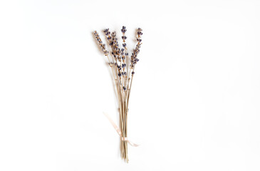 A bunch of dried lavender twigs on white background. Flat lay, copy space.