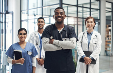 Were always proud to help those in need. Shot of medical staff together at work. - Powered by Adobe