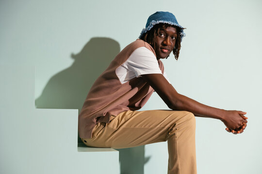 Serious black teenage model in studio