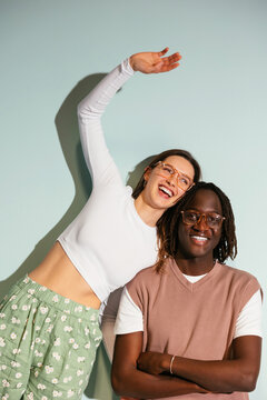 Smiling trendy diverse teenage models in studio