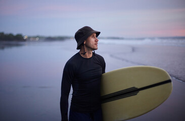 A man inspects the situation with the waves on the ocean