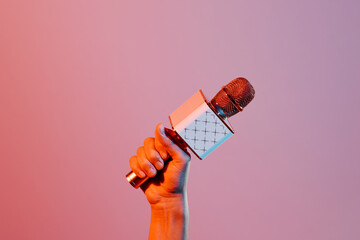 man with a wireless microphone in his hand