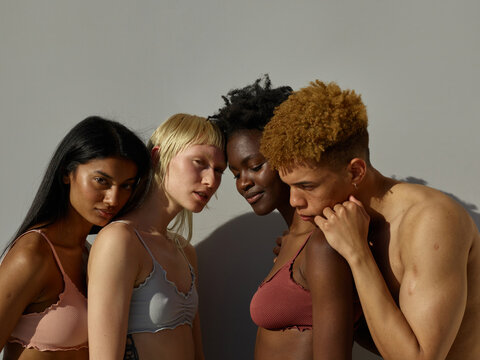 4 supportive friends portrait embracing