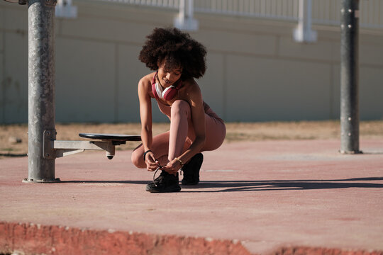 Active woman doing fitness outdoors