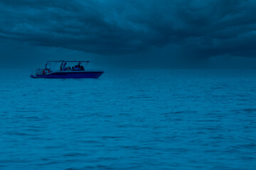 Naklejka premium speedboat takes tourists back from diving at Samae San Island, Chonburi Province.