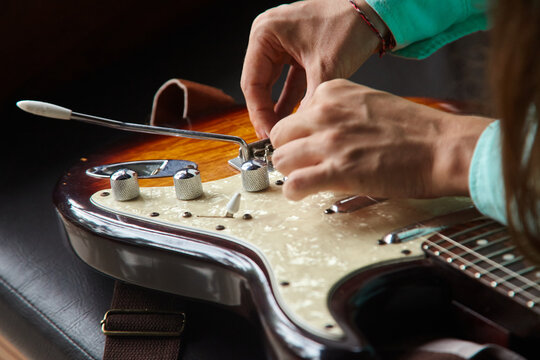 Hands and guitar