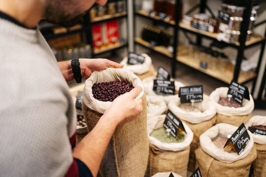 Man working in zero waste shop