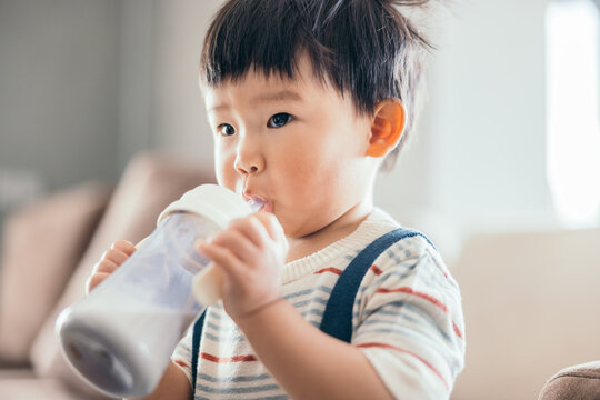 Asian little baby boy drinking milk