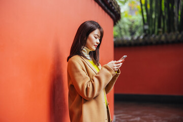 Asian woman using a phone