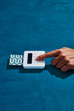 man using a wireless payment terminal