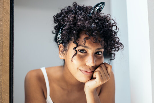 latin young woman with curly hair