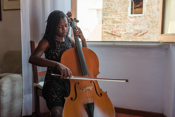 Teen playing cello