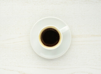 Coffee cup, top view . Coffee cup ona white wooden table. Espresso, hot fresh black coffee