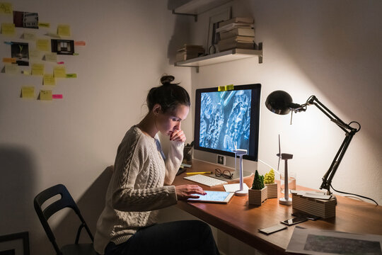 Woman Working From Home At Night