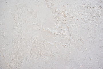 artistic plaster on a gray and white wall. Repairs. elements of wall decor. copy space. texture. background.