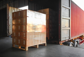 Packaging Boxes Stacked Wrapped Plastic on Pallets Loading with Shipping Cargo Container. Delivery Trucks Loading at Dock Warehouse. Supply Chain. Shipment Logistics. Distribution Freight Transport.	
