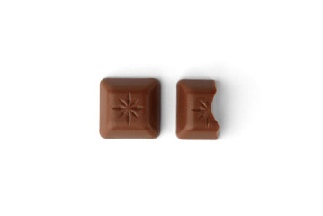 Chocolate pieces with strawberry filling isolated on white background.
