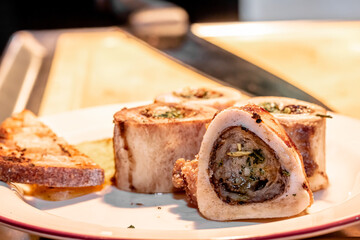 Baked beef bones with bone marrow are on a plate