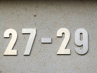 Metal home number on a wall