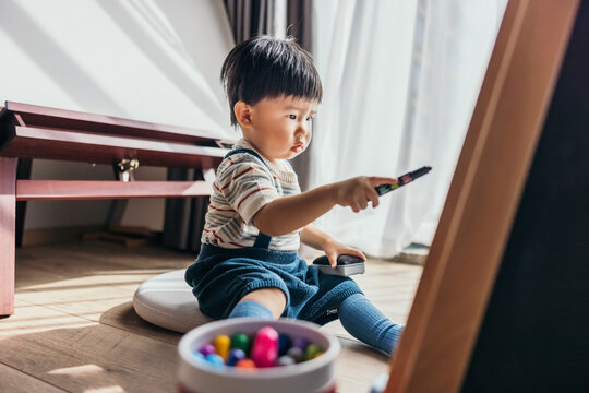 Asian little baby boy drawing