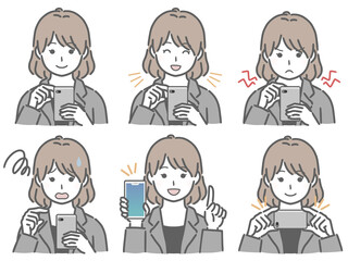 スマホを操作するスーツの若い女性