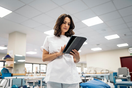 Female doctor using tablet in hospital