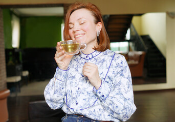 Woman drinking tea. Morning time. Positive emotions. Time for yourself. Happy 