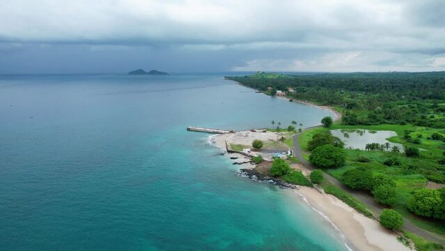 Aerial drone view over sea sand at the Memorial Dos Herois Da Liberdade in Sao Tome, Africa