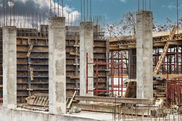 Reinforced concrete foundation of a modern monolithic residential building. Prepared formwork with reinforcing mesh for pouring concrete. Monolithic construction technologies.