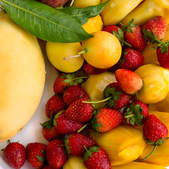 Tropical fruits set background. Mango, plum, strawberry