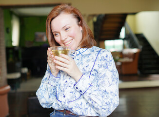 woman drinking tea. Positive emotions. Beautiful face. Have time for yourself. 