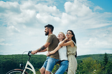 Group adventure with happy and smiling. Woman riding on bike on road along trail on mountain. Camping, jungle adventure concept.