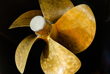 Five-bladed ship propeller close-up, with zinc corrosion protection in the center. - obrazy, fototapety, plakaty