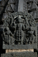 Stone Sculpture of Hindu Gods with selective focus, 12th century Hindu temple, Ancient stone art and sculptures in each pillars, Chennakeshava Temple, Belur, Karnataka, India.