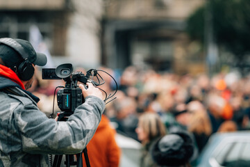 Making news, media cameraman at a public protest