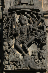 Stone Sculpture of Hindu Gods with selective focus, 12th century Hindu temple, Ancient stone art and sculptures in each pillars, Chennakeshava Temple, Belur, Karnataka, India.