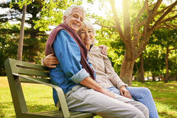 Theyve made theirs, a happy marriage. Portrait of a happy senior couple sitting on a park bench.