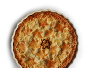 Apple Pie with double crust with cinnamon made with shortcrust pastry isolated on white background with star shape decoration