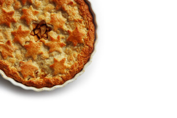 Apple Pie with double crust with cinnamon made with shortcrust pastry isolated on white background with star shape decoration