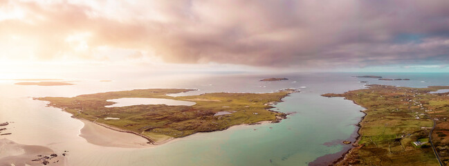 Aerial view on Omey island and beach. County Galway, Ireland. Place of horse racing in summer . Panorama image. High tide. Cloudy sky. Beautiful Irish nature landscape