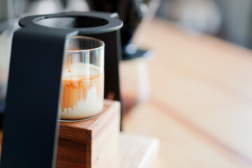 drop of espresso shot on chilled milk, home brewing process