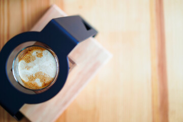 drop of espresso shot on chilled milk, home brewing process