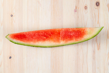Fototapeta na wymiar bitten red ripe watermelon divided into pieces