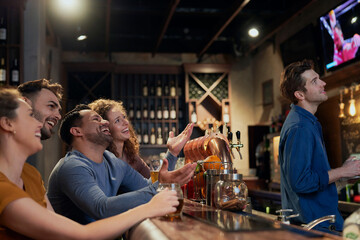 Group of friends watching match in the pub