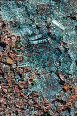 broken glass on the asphalt after an accident with a car