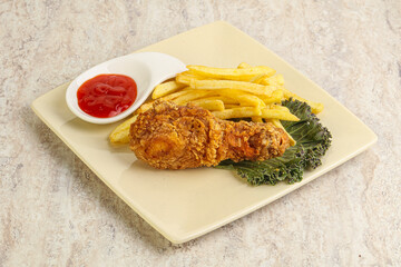 Crispy chicken leg with fry potato