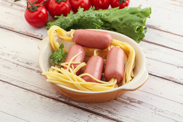 Mini sausages with pasta spaghetti