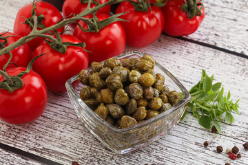 Marinated green capers in the bowl