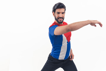 let's start dancing - bearded Latin American man in T-shirt of Cuban flag making dance element on...